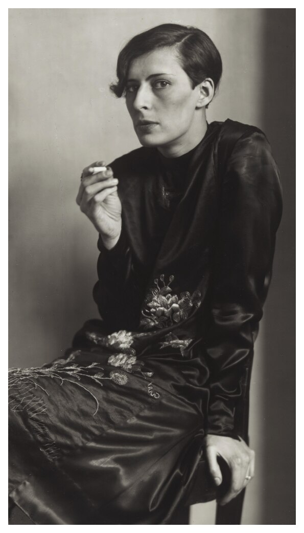 Woman with cigarette, studio portrait (August Sander)