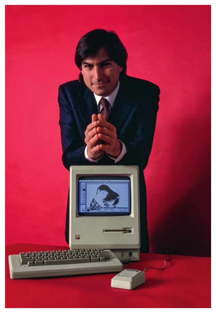 Steve Jobs with the original Macintosh, 1984