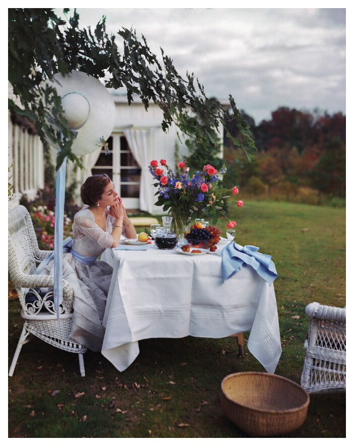 Woman at a garden table